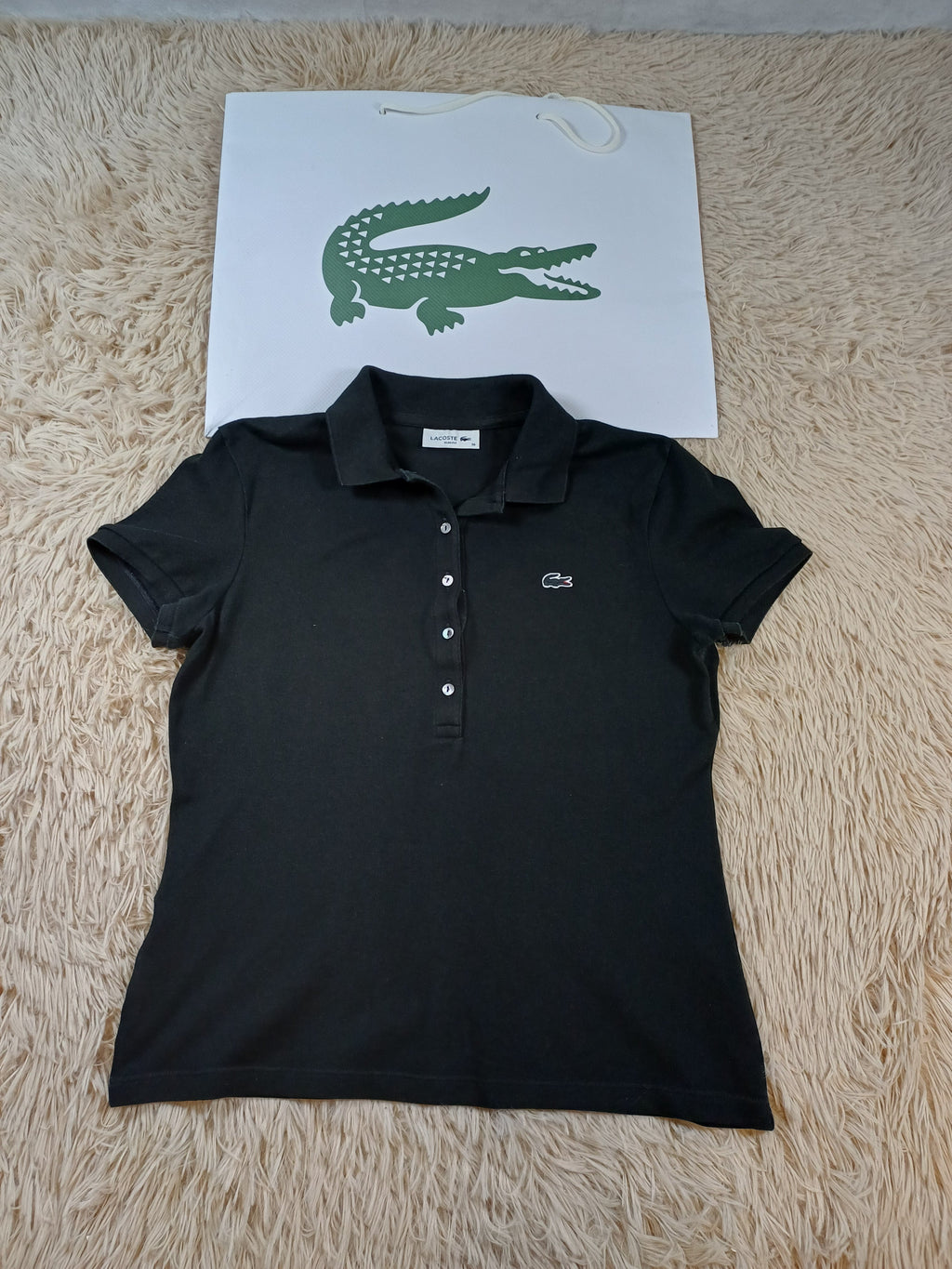 Polo noir Lacoste femme – taille 38 Lacoste