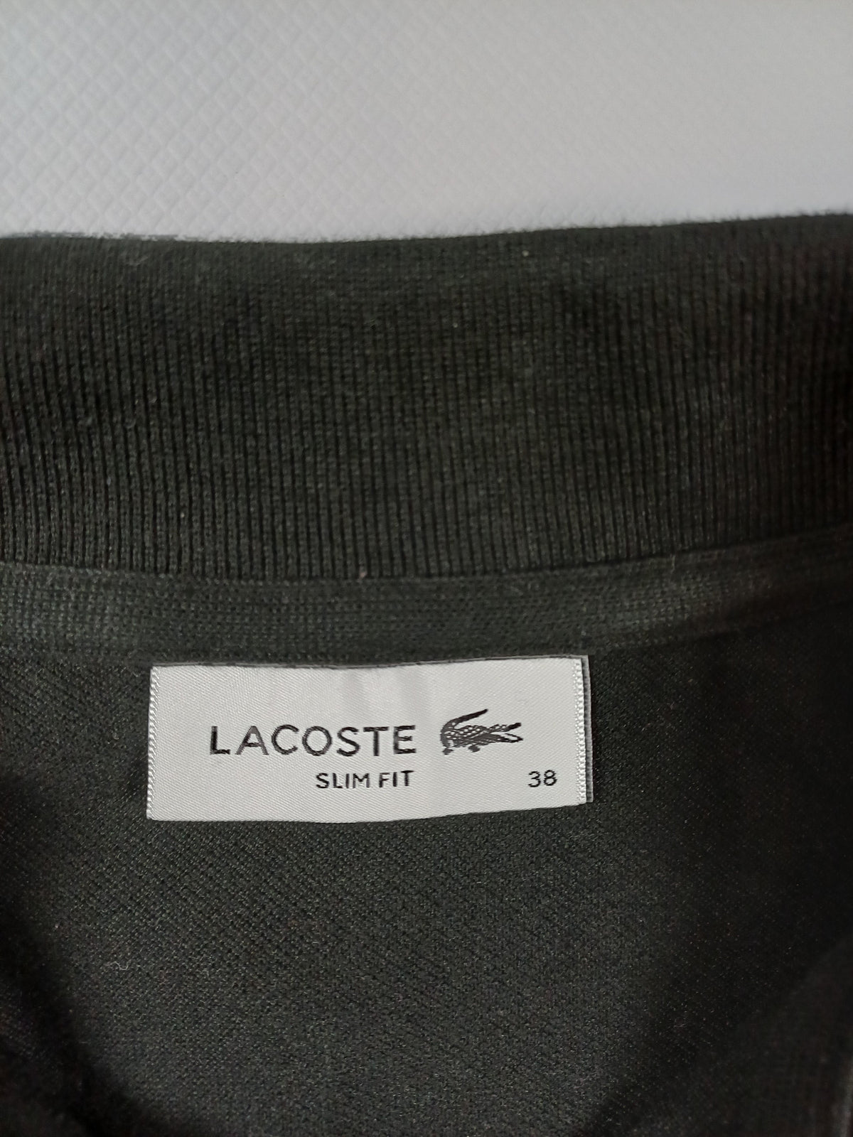 Polo noir Lacoste femme – taille 38 Lacoste