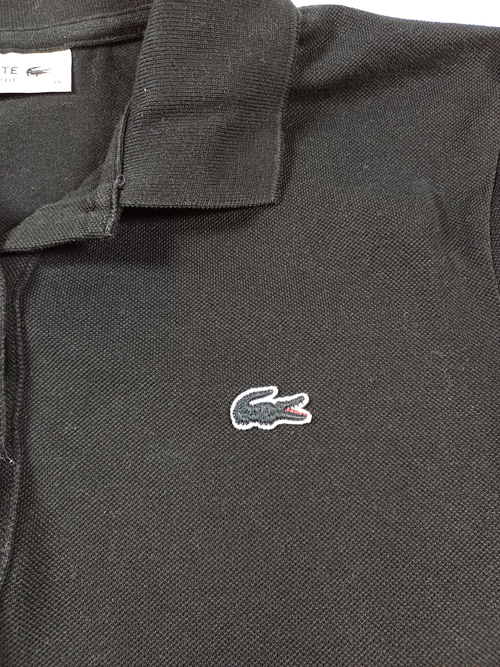 Polo noir Lacoste femme – taille 38 Lacoste
